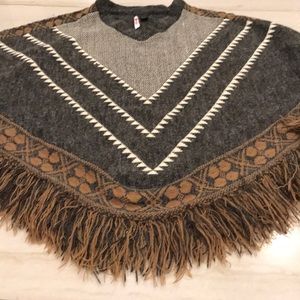 Boho style poncho sweater with cuffed sleeves